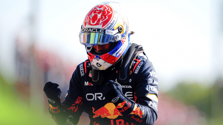 Max Verstappen raises his fists in celebration in parc ferme at Monza