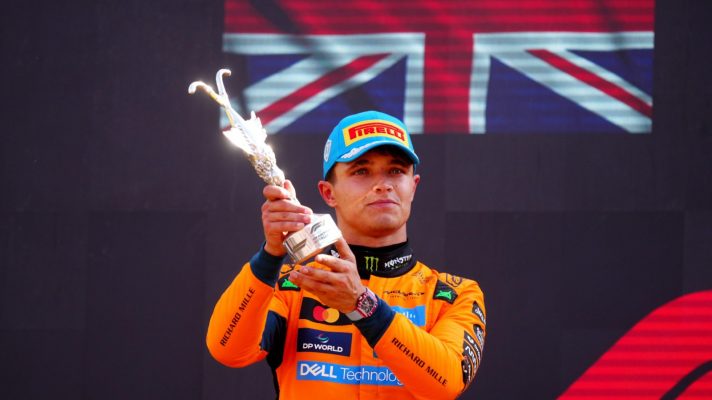 Lando Norris lifts his P2 trophy at Monza