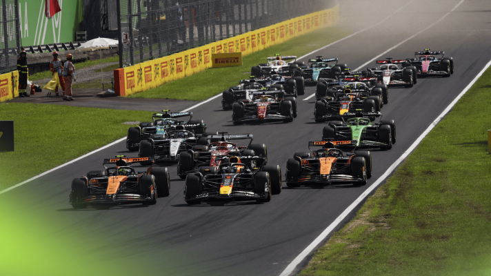 The F1 field approaches the first corner at Monza