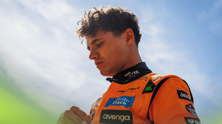 Lando Norris prepares for the start at Monza with a blue sky in the background