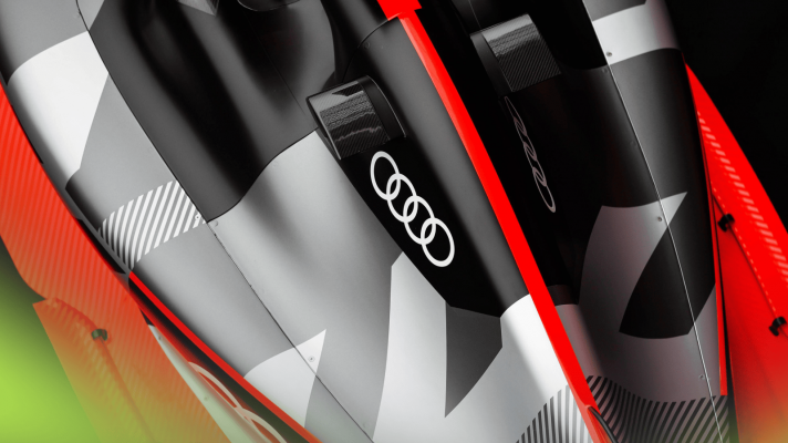 An overhead shot of the Audi F1 showcar with the four rings logo prominent on the engine cover