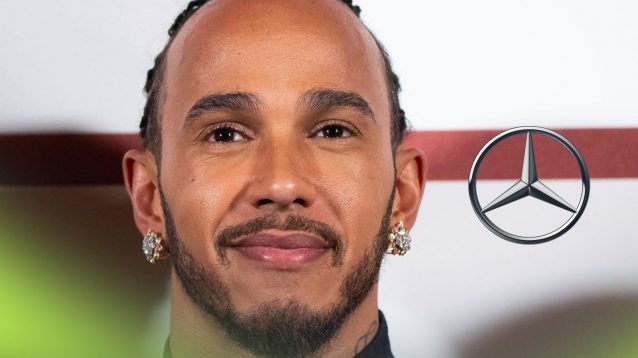Lewis Hamilton poses at the F1 movie premiere, with a Mercedes badge on his right