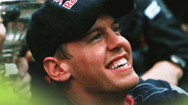 Sebastian Vettel smiles widely during Red Bull's celebrations at the 2009 Chinese Grand Prix