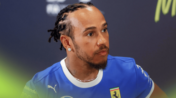 Lewis Hamilton looks on alert in an FIA press conference