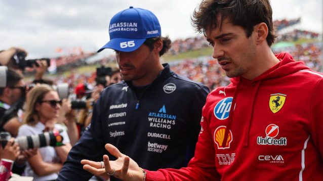 Charles Leclerc speaking with Carlos Sainz