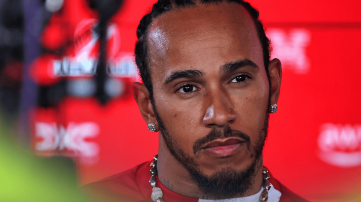 A close-up shot of Lewis Hamilton facing the media in Baku