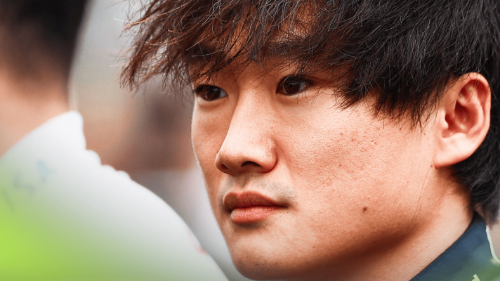 A close-up shot of Yuki Tsunoda during the national anthem in Baku