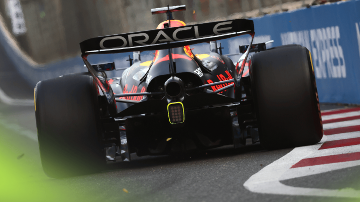 A rear-facing shot of Max Verstappen's Red Bull RB21 on track in Baku