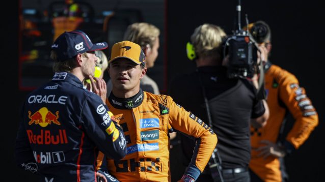 Max Verstappen speaking with Lando Norris, Oscar Piastri in the background