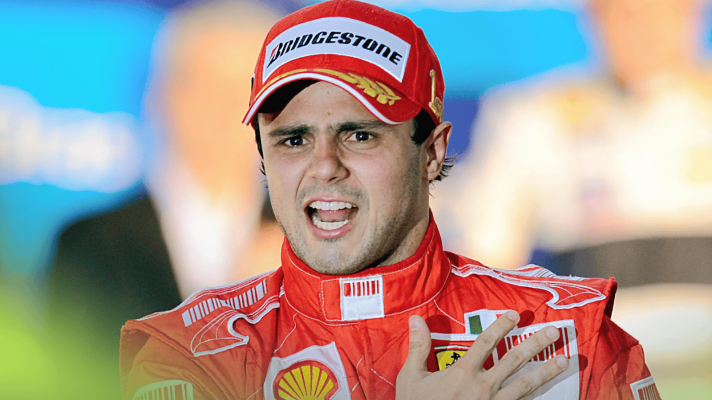 Felipe Massa shouts as he beats his chest on the podium at Interlagos in 2008