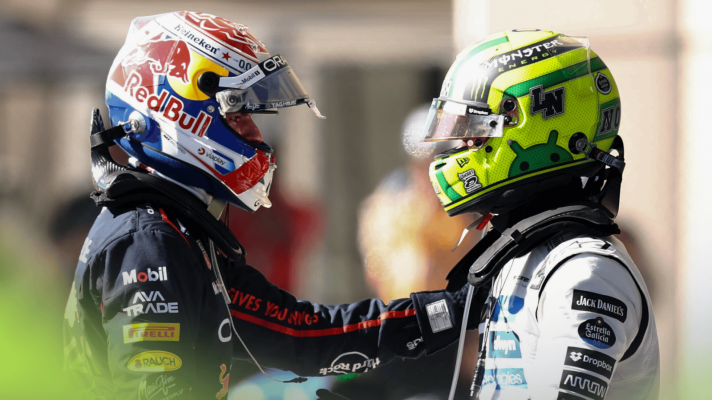 Max Verstappen and Lando Norris in conversation with their helmets still on in parc ferme in Austin