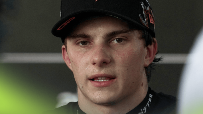 Oscar Piastri eyes the camera as he faces the media