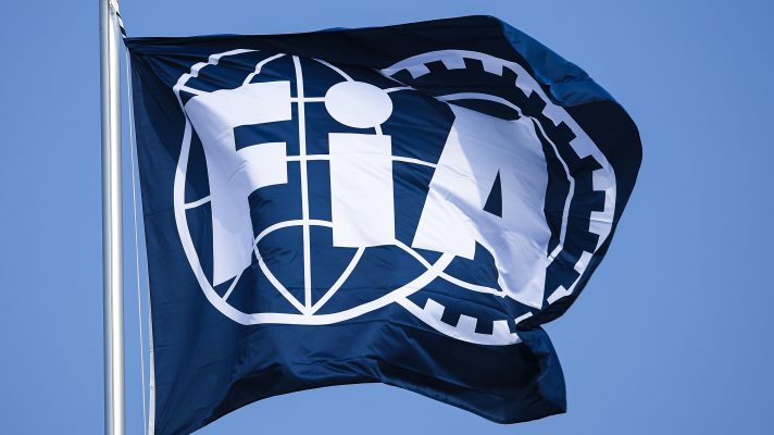 The FIA logo on a flag