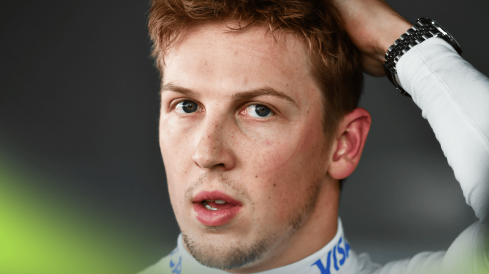 A close-up shot of Liam Lawson as he faces the media
