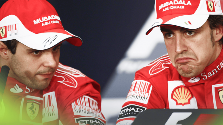 Felipe Massa and Fernando Alonso look awkward in a press conference in Bahrain in 2010