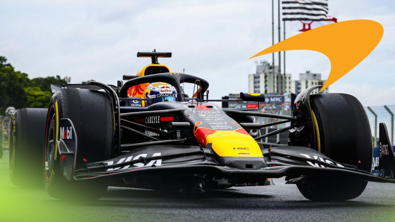 Max Verstappen's Red Bull RB21 pictured from ground level at the 2025 Brazilian Grand Prix, as a McLaren logo appears top right
