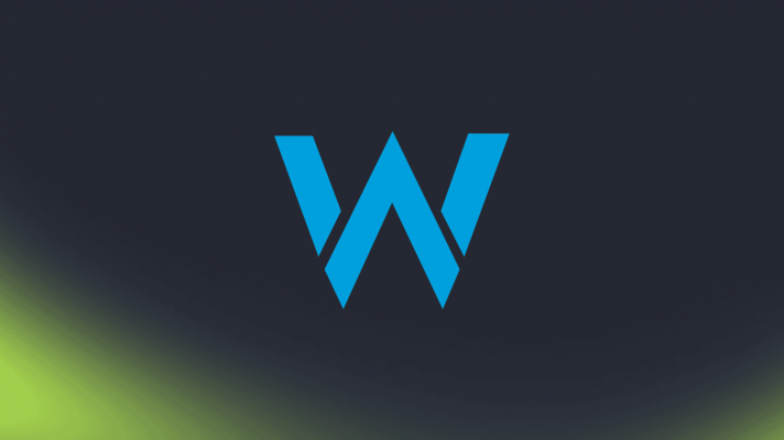 The 'W' logo of the Williams F1 team against a dark background