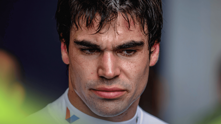 A close-up shot of Lance Stroll looking unimpressed