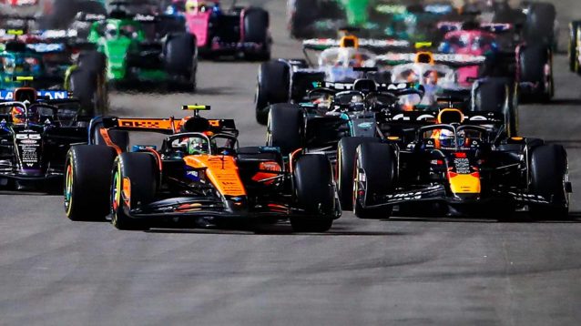 Lando Norris cuts across Max Verstappen at the start of the Las Vegas GP.