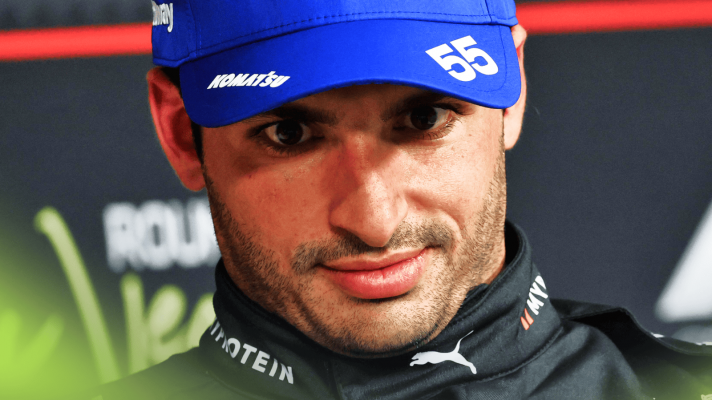 A close-up shot of Carlos Sainz in a press conference