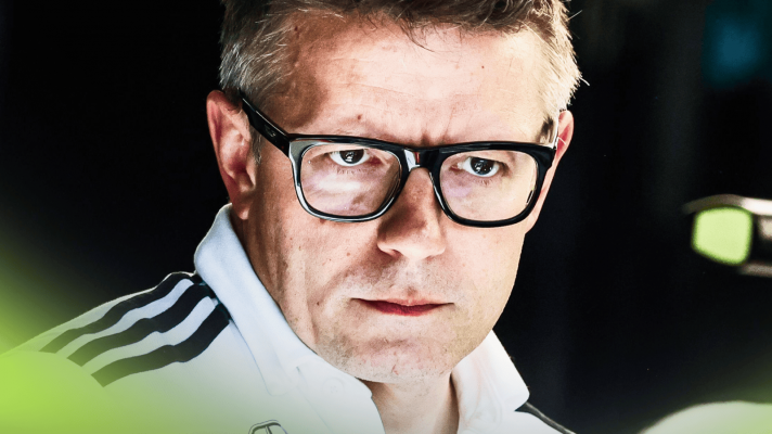 A close-up shot of Peter Bonnington looking on in the Mercedes garage