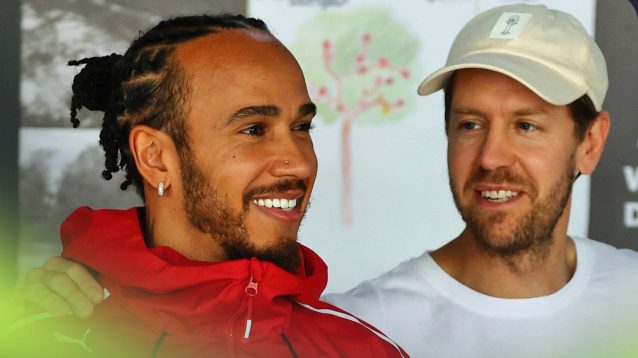 Lewis Hamilton alongside Sebastian Vettel.