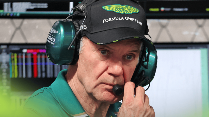 Adrian Newey adjusts his headphones as he looks on from the Aston Martin pit wall in Qatar