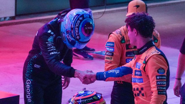 George Russell bows to Lando Norris