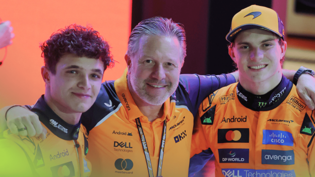 Lando Norris, Zak Brown and Oscar Piastri pose together in parc ferme