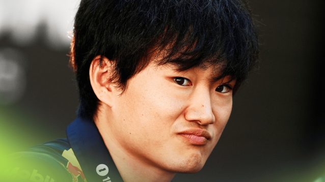 Yuki Tsunoda eyes the camera as he faces the media in Abu Dhabi