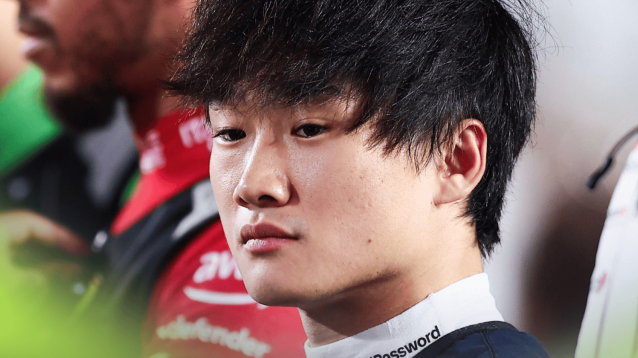 A close-up shot of Yuki Tsunoda on the grid in Qatar