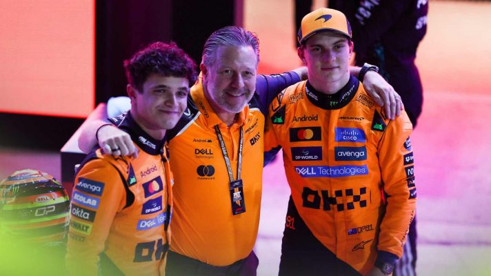 McLaren CEO Zak Brown with Lando Norris and Oscar Piastri.