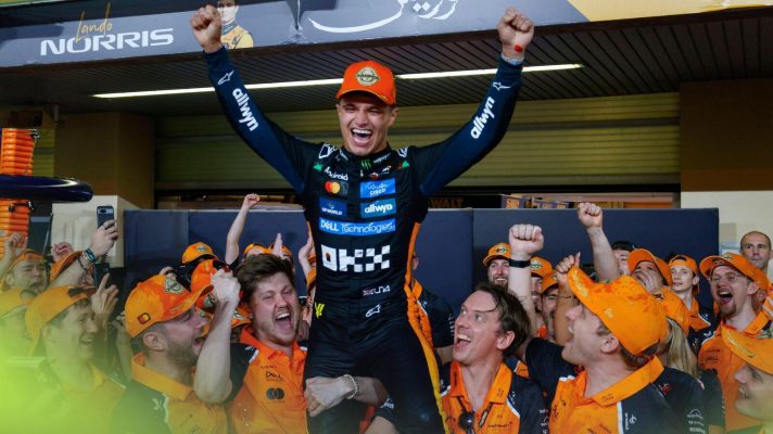 Lando Norris celebrates winning the F1 2025 championship.