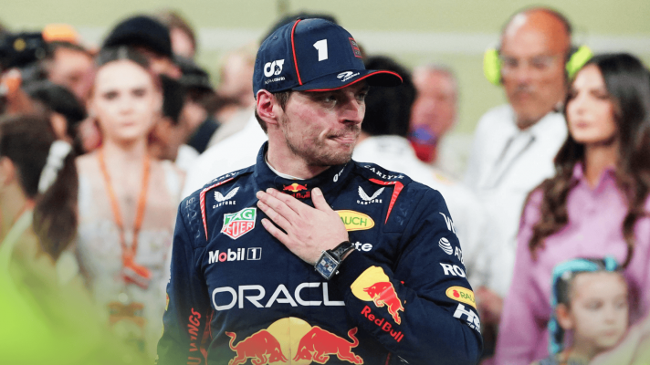Max Verstappen holds his hand to his chest after the race in Abu Dhabi with his family in the background