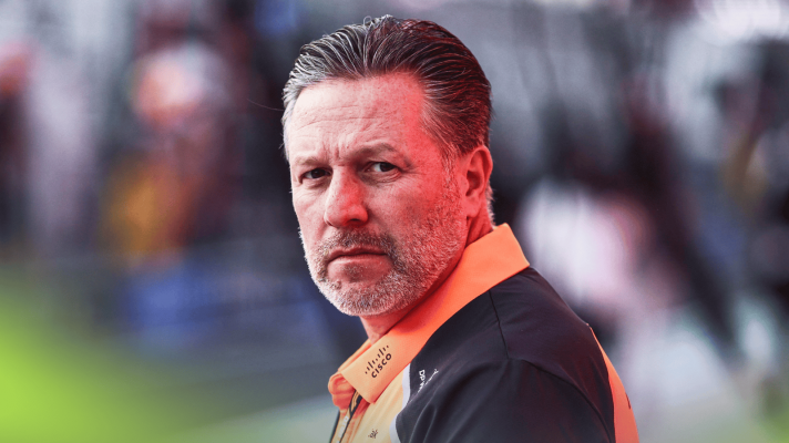 Zak Brown turns his head in the pit lane in Qatar