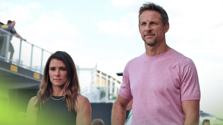 Danica Patrick and Jenson Button stood side by side in the paddock in Austin