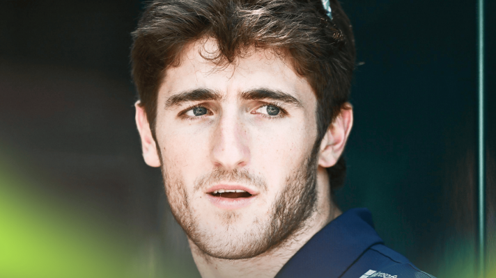 A close-up shot of Jack Doohan in the F1 paddock
