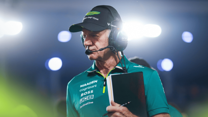 Adrian Newey clutching his notebook on the grid in Qatar