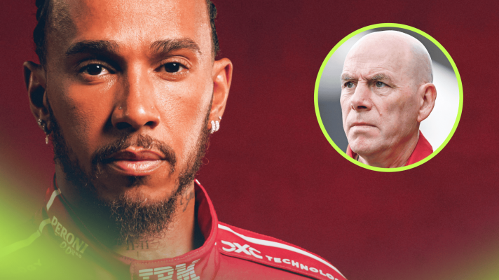 Lewis Hamilton eyes the camera while wearing Ferrari overalls with an inset of Jock Clear