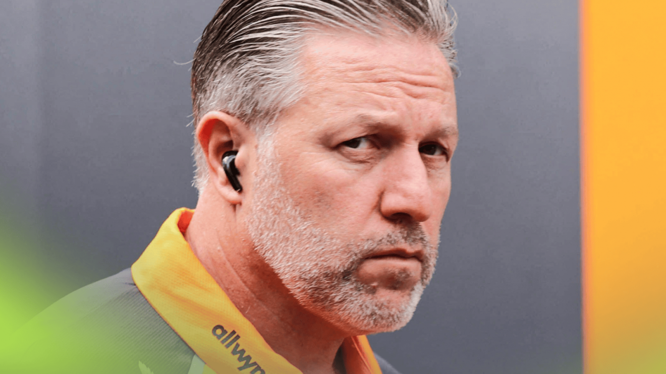Zak Brown eyes the camera in the F1 paddock in Hungary