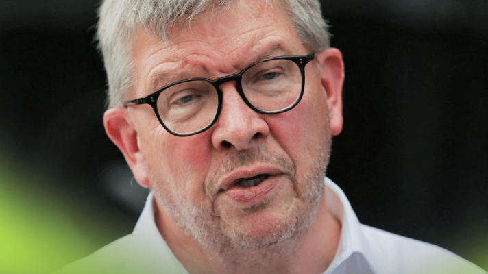 A close-up shot of Ross Brawn in conversation in the paddock