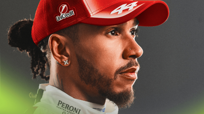 A portrait shot of Lewis Hamilton modelling Ferrari's 2026 cap and overalls