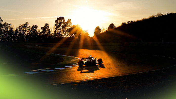 An F1 car on track at sunset in Barcelona