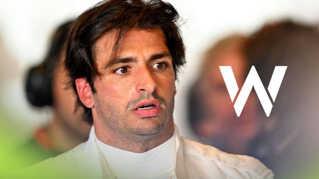 Carlos Sainz in the Williams garage at 2024 Abu Dhabi testing, as the Williams logo appears on the right