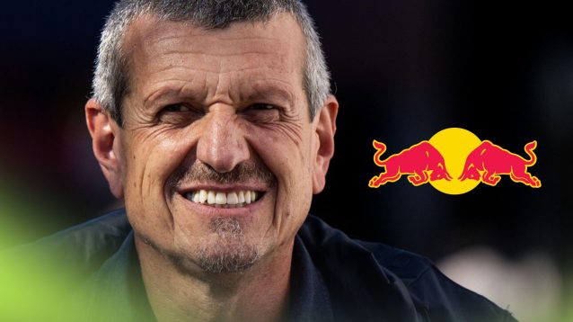 Guenther Steiner smiling at the 2025 Dutch Grand Prix, as a Red Bull logo appears on the right