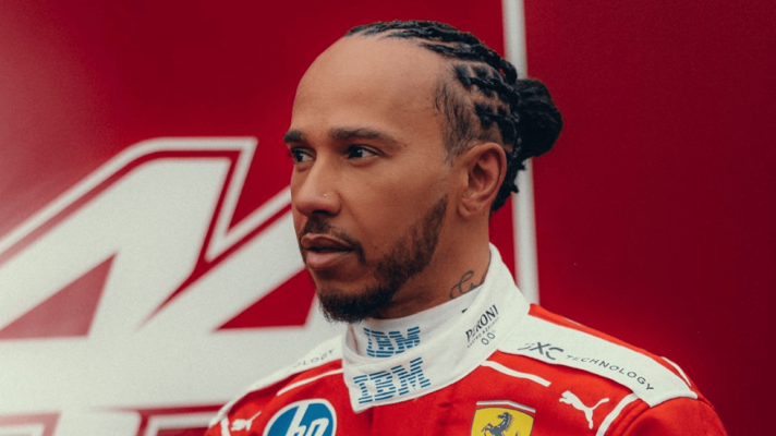 Lewis Hamilton looks on while wearing Ferrari 2026 overalls in Barcelona