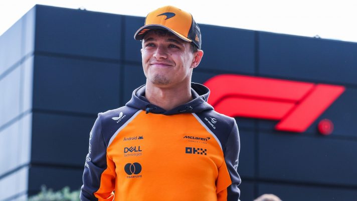 Lando Norris of McLaren arrives in the paddock