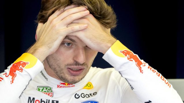 Max Verstappen with his hands to his head