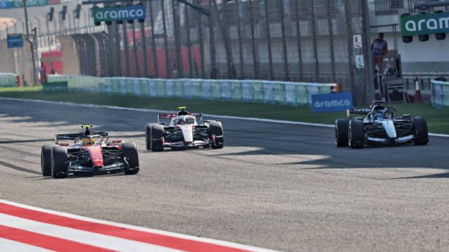 Lewis Hamilton passes George Russell in a practice race start