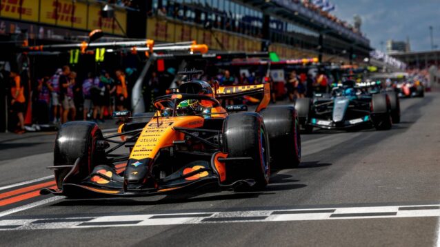 Oscar Piastri, McLaren, ahead of George Russell, Mercedes, in the Australian GP pit lane